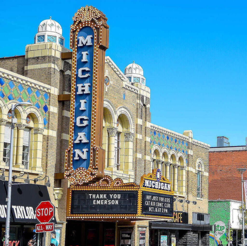 Outdoor photo of the Michigan Theater medium shot off Liberty St with the marquee and full building in view