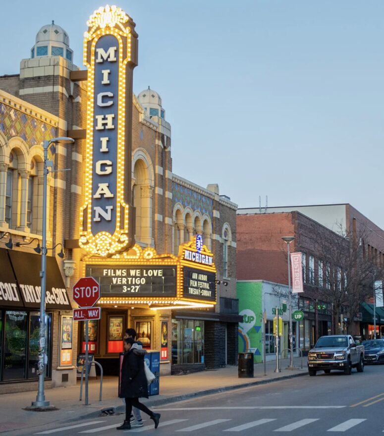 Outdoor photo of the Michigan Theater medium shot off Liberty St with the marquee and full building in view