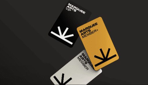 Photo of the New Marquee Arts Membership Cards that are black, yellow, or white depending on the level of membership